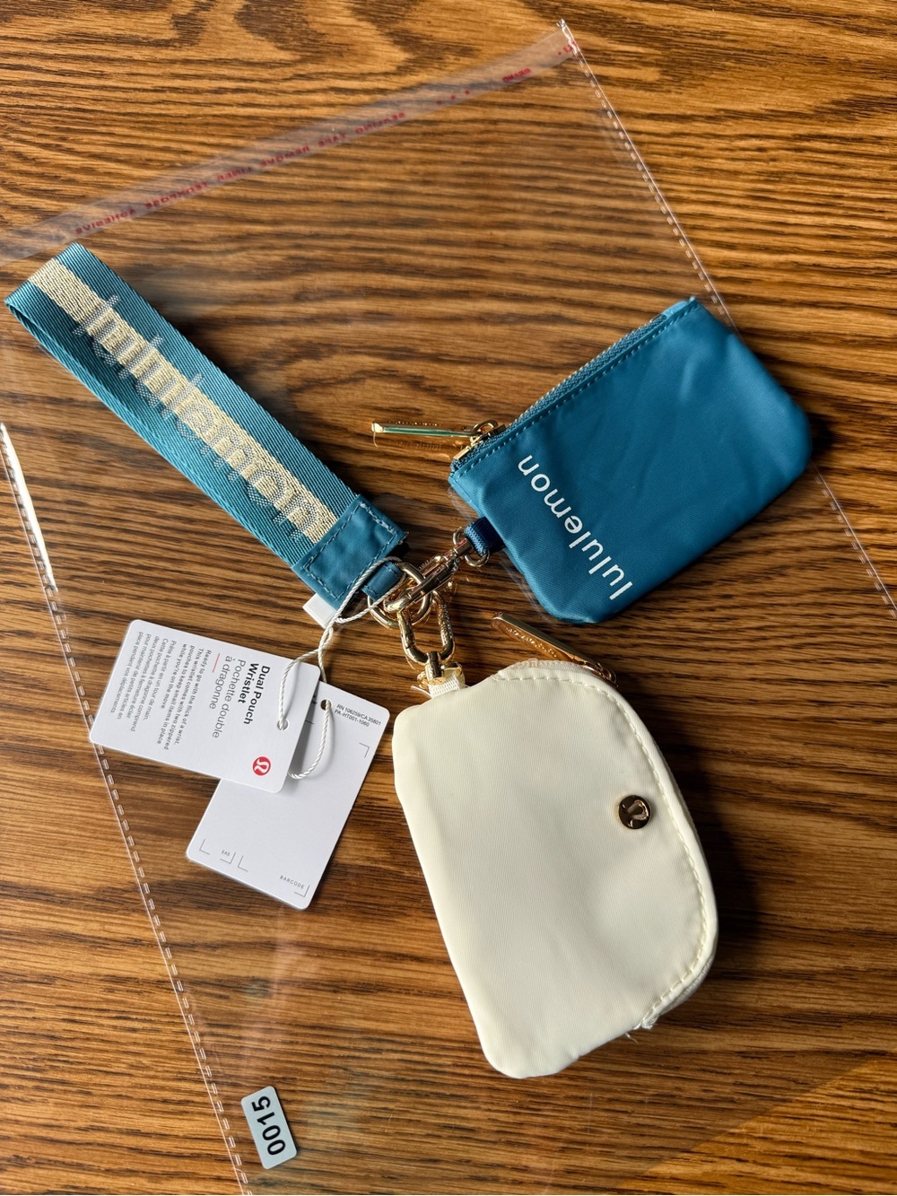 lululemon Teal Wristlet and Cream Coin Pouch with Gold Hardware